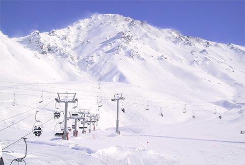 Intersecting chairlifts and view of 'Eduardo's' (mountain) in the background.